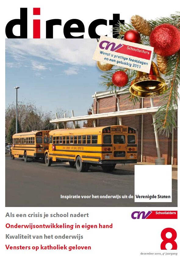 Two yellow school buses parked at school