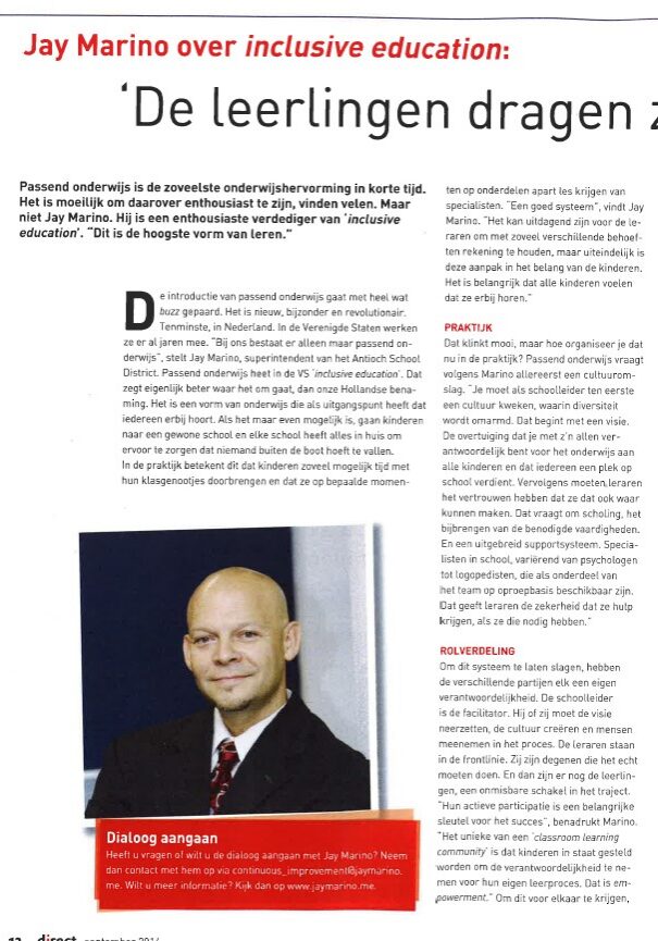 Magazine page showing headshot of smiling man